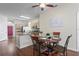 Bright dining area adjacent to the kitchen with modern table set and decorative accents at 3042 Gianna Way, Land O Lakes, FL 34638