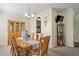 Dining area featuring a wood table for six and glass front china cabinet at 3042 Gianna Way, Land O Lakes, FL 34638