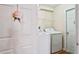 A white washer and dryer set in a bright laundry room at 3042 Gianna Way, Land O Lakes, FL 34638