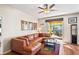 Comfortable living room offers sliding glass doors to outdoor patio and seating area at 3042 Gianna Way, Land O Lakes, FL 34638