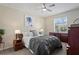 Relaxing main bedroom with a ceiling fan, a dresser, and a peaceful atmosphere at 3042 Gianna Way, Land O Lakes, FL 34638