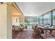 Screened patio with outdoor dining, seating, and pool views at 3042 Gianna Way, Land O Lakes, FL 34638