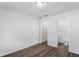 Neutral bedroom with wood-look floors, a walk-in closet and an attached bathroom at 3209 Kismet Ct, New Port Richey, FL 34655
