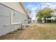The exterior shows well-kept property with an enclosed porch that offers extra outdoor living space at 3209 Kismet Ct, New Port Richey, FL 34655