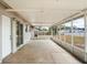 Covered and screened-in back patio featuring a concrete floor at 3209 Kismet Ct, New Port Richey, FL 34655