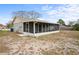The property features a spacious screened porch, ideal for outdoor living and entertaining in comfort at 3209 Kismet Ct, New Port Richey, FL 34655