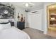 Bedroom with a bed, a mounted tv, and closet space at 3733 Wiregrass Rd, New Port Richey, FL 34655