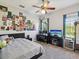 Bedroom with a bed and a desk with computer on top of it at 3733 Wiregrass Rd, New Port Richey, FL 34655
