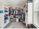 Walk-in closet with custom shelving, drawers, and plenty of storage space at 3733 Wiregrass Rd, New Port Richey, FL 34655