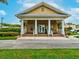 Exterior of community building featuring a welcoming entrance with classic columns and a sign at 3733 Wiregrass Rd, New Port Richey, FL 34655