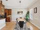 Bright dining room with stylish decor, hardwood floors, and ample seating for entertaining at 3733 Wiregrass Rd, New Port Richey, FL 34655