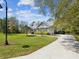 Beautiful home with large yard, mature trees and a winding driveway at 3733 Wiregrass Rd, New Port Richey, FL 34655