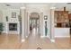 Spacious hallway featuring archways, decorative columns, and tiled flooring at 3733 Wiregrass Rd, New Port Richey, FL 34655