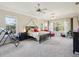 Large main bedroom with multiple windows, ceiling fan, and ample natural light at 3733 Wiregrass Rd, New Port Richey, FL 34655