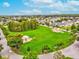 A beautiful, expansive park for the community with green grass, a covered picnic area, and walking trails at 3733 Wiregrass Rd, New Port Richey, FL 34655