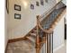 Carpeted staircase with dark metal spindles and wooden handrail leading to the upper level at 3733 Wiregrass Rd, New Port Richey, FL 34655