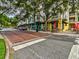 Charming street view featuring vibrant storefronts with outdoor seating and a brick-paved crosswalk at 3733 Wiregrass Rd, New Port Richey, FL 34655