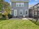 Exterior back of house with patio area, seating, and a grill at 3733 Wiregrass Rd, New Port Richey, FL 34655