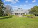 Beautiful house with a large front yard and covered porch at 3733 Wiregrass Rd, Trinity, FL 34655