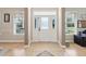 Foyer with tiled flooring, decorative glass door, and natural light at 3733 Wiregrass Rd, New Port Richey, FL 34655