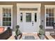 Close-up of the front door with sidelights and house number at 3733 Wiregrass Rd, Trinity, FL 34655