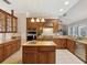 Well-equipped kitchen showcases granite counters, modern appliances, and ample cabinet space at 3733 Wiregrass Rd, New Port Richey, FL 34655