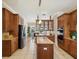 Gourmet kitchen features stainless steel appliances, granite countertops, and wood cabinets at 3733 Wiregrass Rd, New Port Richey, FL 34655