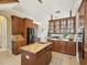 Spacious kitchen with granite countertops, a central island, and stainless steel appliances at 3733 Wiregrass Rd, Trinity, FL 34655