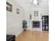 Living room featuring a fireplace, wood floors, and modern decor at 3733 Wiregrass Rd, New Port Richey, FL 34655