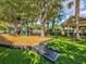 This neighborhood playground has play equipment, a grassy area, and a covered picnic area at 3733 Wiregrass Rd, Trinity, FL 34655