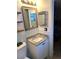 Bathroom features a vanity with granite countertops, ample storage, and a large mirror at 4030 Grayton Dr, New Port Richey, FL 34652