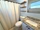 Updated bathroom with granite vanity, modern fixtures, and tiled floors at 4030 Grayton Dr, New Port Richey, FL 34652