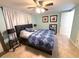 Cozy bedroom with a ceiling fan and ensuite bathroom at 4030 Grayton Dr, New Port Richey, FL 34652