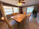 Bright dining room with water view, ceiling fan, and tile flooring at 4030 Grayton Dr, New Port Richey, FL 34652