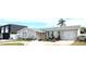 Beautiful single-story home with stone facade, attached garage, and manicured landscaping at 4030 Grayton Dr, New Port Richey, FL 34652