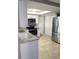 Well-lit kitchen features stainless steel appliances and granite countertops at 4030 Grayton Dr, New Port Richey, FL 34652