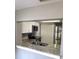 Modern kitchen area features granite countertops, stainless steel appliances, and white cabinets at 4030 Grayton Dr, New Port Richey, FL 34652