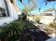Beautiful landscaping with various plants, bushes and pots, adding vibrant color to the garden at 4030 Grayton Dr, New Port Richey, FL 34652