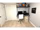 Finished room with modern desk and shelving is a great space for a home office or study at 4030 Grayton Dr, New Port Richey, FL 34652