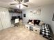 Finished room with desk and shelving is the perfect space for a home office at 4030 Grayton Dr, New Port Richey, FL 34652