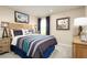 Themed bedroom featuring sports decor, a comfortable bed, and ample lighting at 4649 Spire Run, Lakewood Ranch, FL 34211