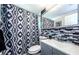 Updated bathroom with mosaic tile accents, a modern vanity, and a stylish shower curtain at 4938 Fruitwood Loop, Holiday, FL 34690