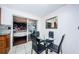 View of dining area with a mirrored wall that leads into a separate bedroom at 4938 Fruitwood Loop, Holiday, FL 34690