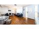 Cozy living room with velvet sofas, a glass coffee table, and ample natural light from the nearby window at 4938 Fruitwood Loop, Holiday, FL 34690