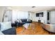 Modern living room with stylish velvet sofa, glass-topped coffee table, and decorative lighting fixtures at 4938 Fruitwood Loop, Holiday, FL 34690