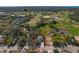 Beautiful aerial view of the property showing its proximity to a golf course and baseball field at 513 Meres Blvd, Tarpon Springs, FL 34689