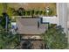 Aerial view of the house showcasing the well-maintained yard, long driveway, and proximity to neighboring properties at 513 Meres Blvd, Tarpon Springs, FL 34689