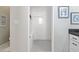 This bathroom features an all-white shower with bench seating and a light gray floor at 513 Meres Blvd, Tarpon Springs, FL 34689