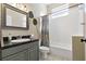 Neutral bathroom featuring classic vanity, mirror, and a tiled shower/tub combo at 513 Meres Blvd, Tarpon Springs, FL 34689
