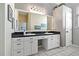 Bathroom featuring double sinks with a vanity and large mirror at 513 Meres Blvd, Tarpon Springs, FL 34689